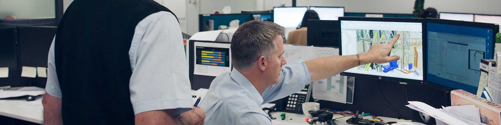 Workers inside the GR Engineering office